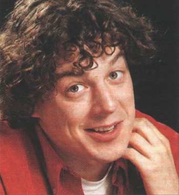 Alan Davies in a red shirt - head and shoulder shot