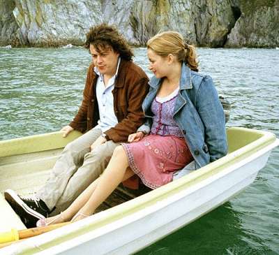 A publicity shot from The Seer of the Sands, Jonathan and Carla share a boat